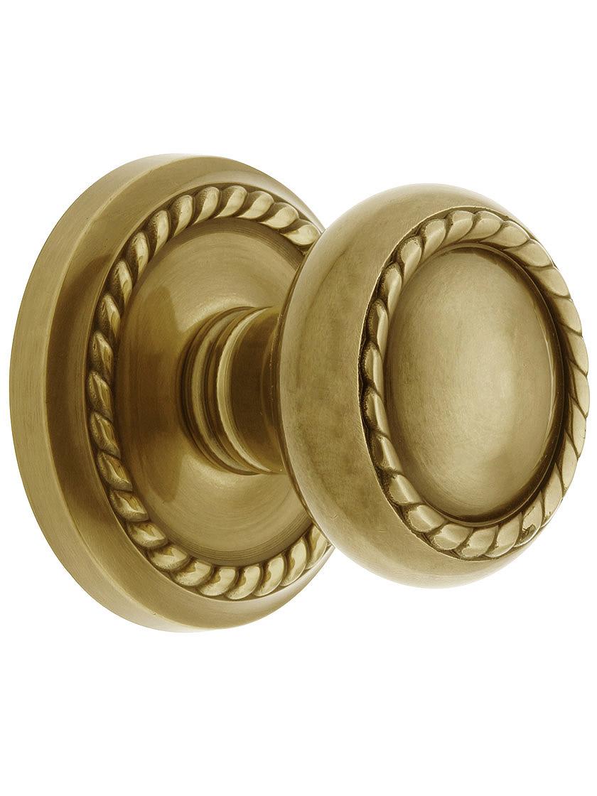 Classic Rope Rosette Set With Matching Rope Door Knobs in Antique Brass.